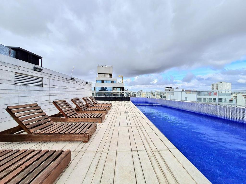 a row of benches sitting on top of a building at Nice Studio in Palermo Soho in Buenos Aires