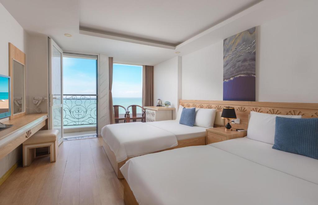 Giường trong phòng chung tại Nang Vang Hotel Nha Trang
