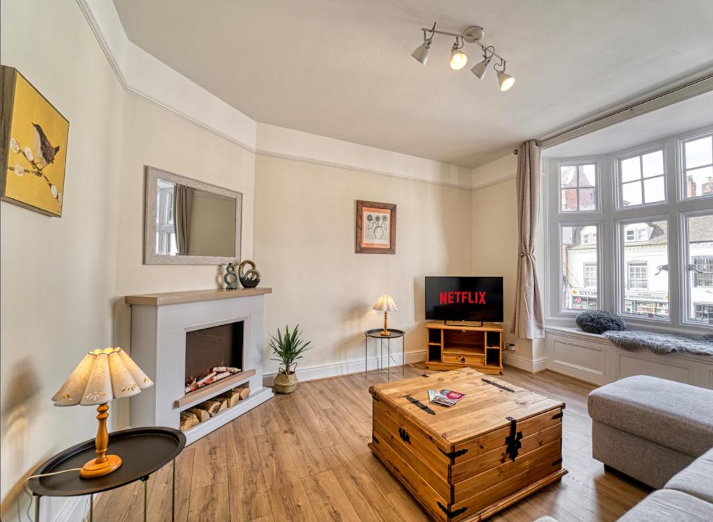 a living room with a couch and a coffee table at Central Worcester Apartment - Free Parking, 1 Bed in Henwick