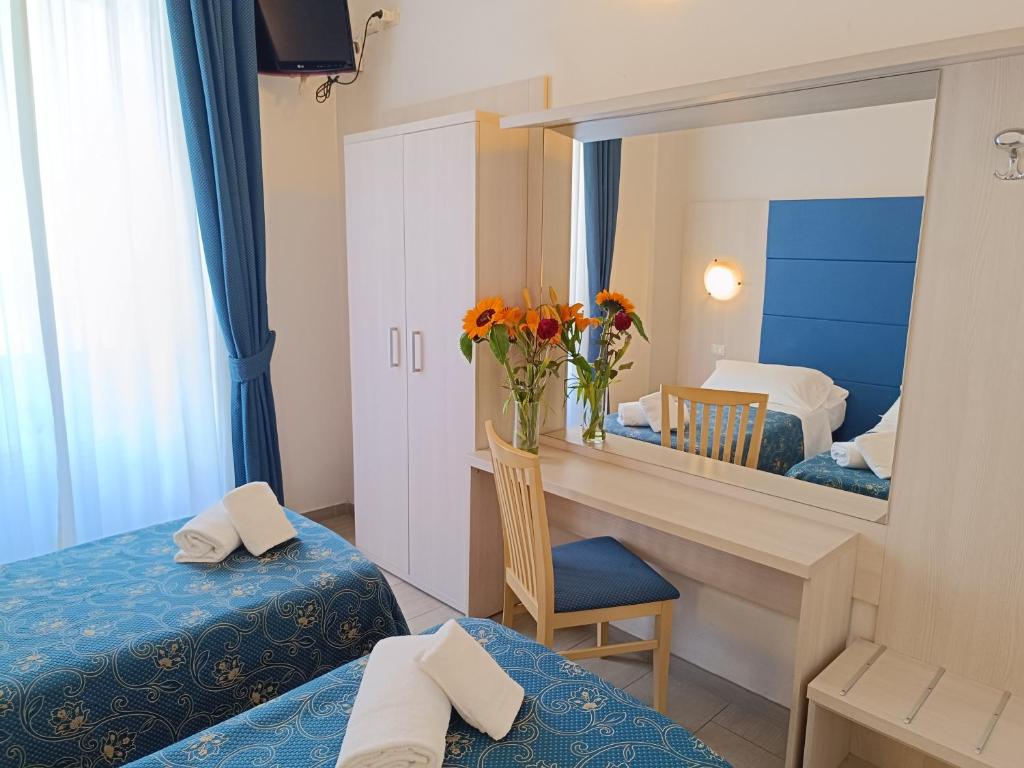 Postel nebo postele na pokoji v ubytování Albergo Marechiaro