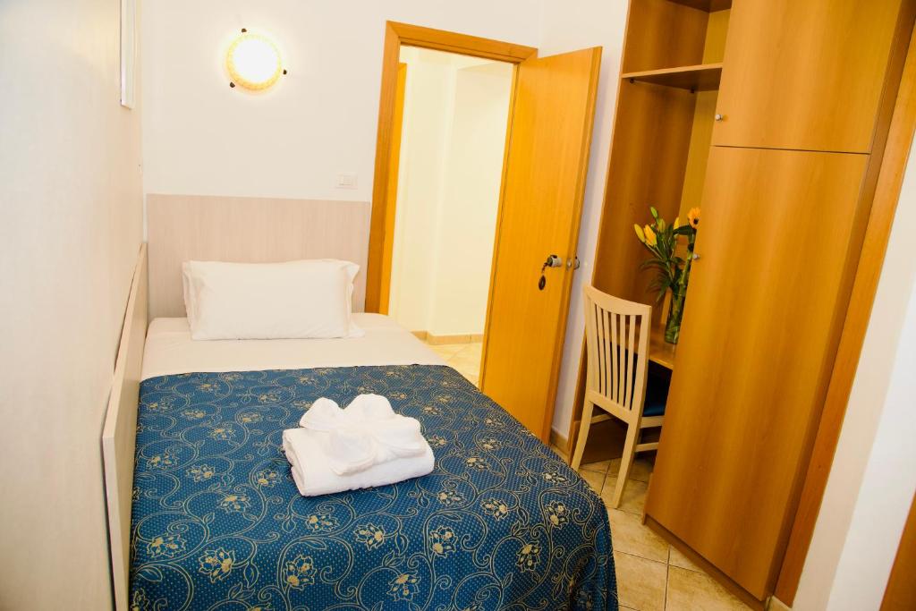 Postel nebo postele na pokoji v ubytování Albergo Marechiaro