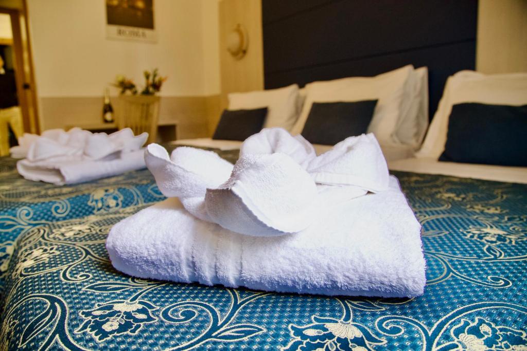 Postel nebo postele na pokoji v ubytování Albergo Marechiaro