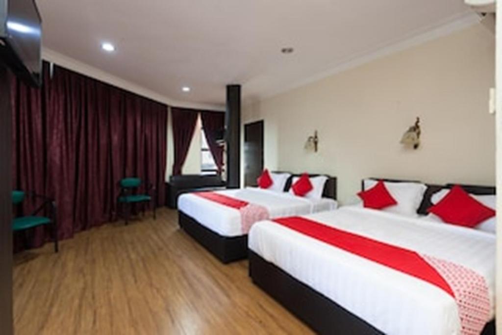 Postel nebo postele na pokoji v ubytování OYO 43915 T P Hotel