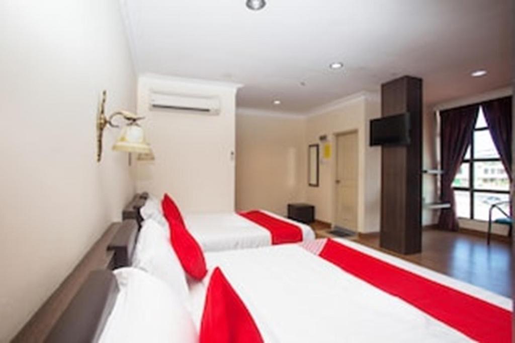 Postel nebo postele na pokoji v ubytování OYO 43915 T P Hotel