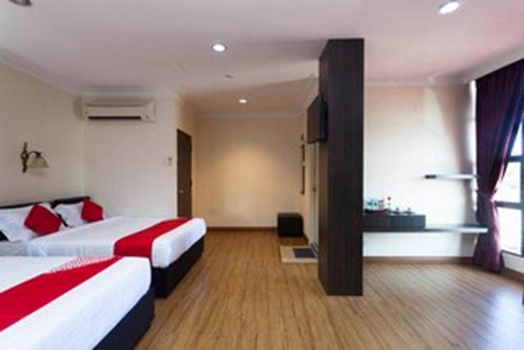 Postel nebo postele na pokoji v ubytování OYO 43915 T P Hotel