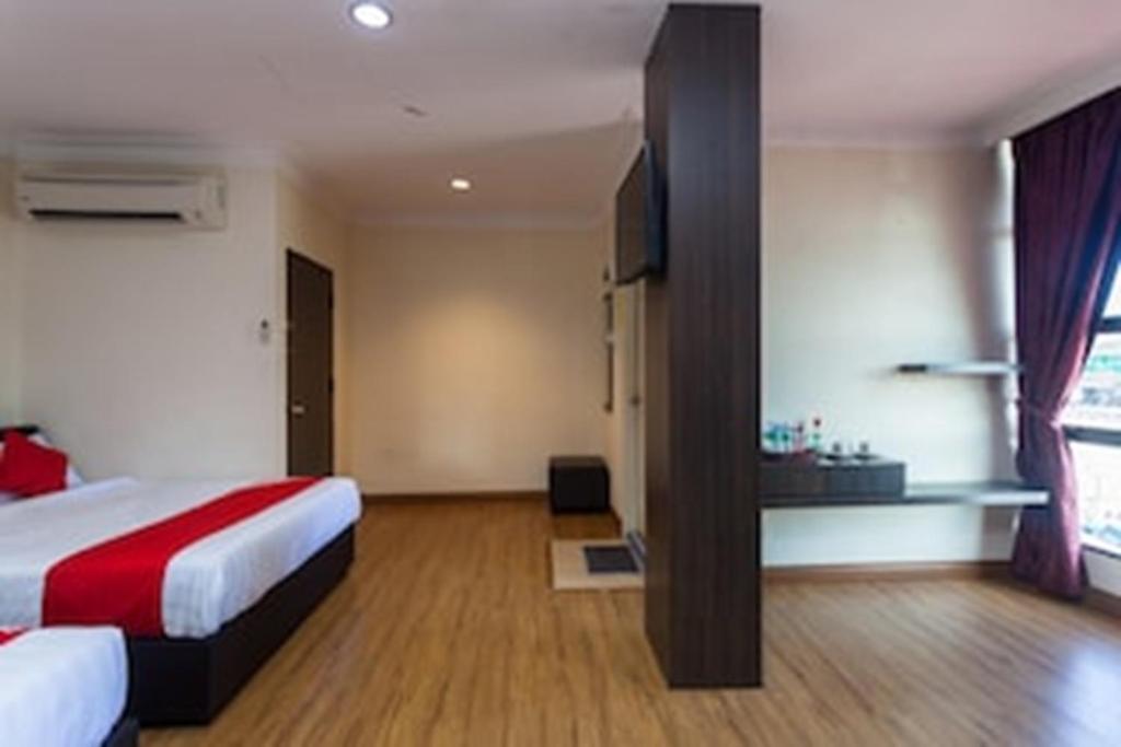 Postel nebo postele na pokoji v ubytování OYO 43915 T P Hotel