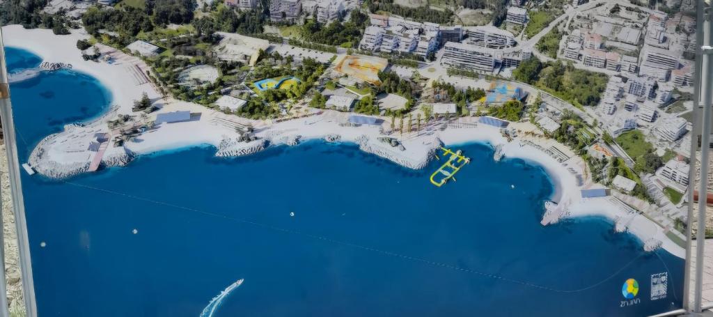 a map of a resort with blue water at Adela Apartments - Beach Žnjan Split in Split