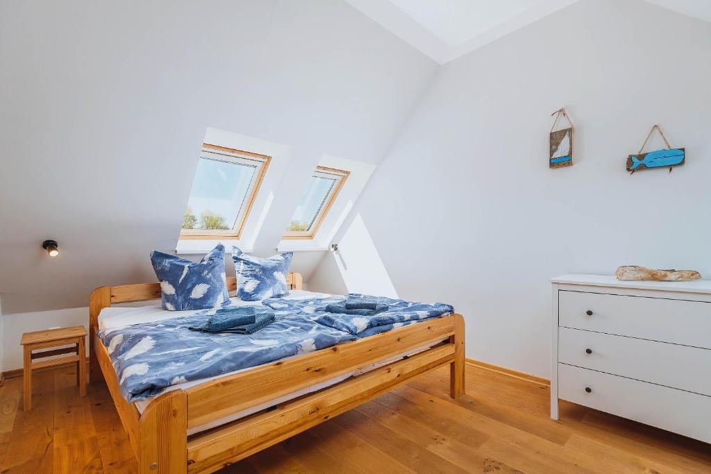 Postel nebo postele na pokoji v ubytování Kuddels Fischerhus 2