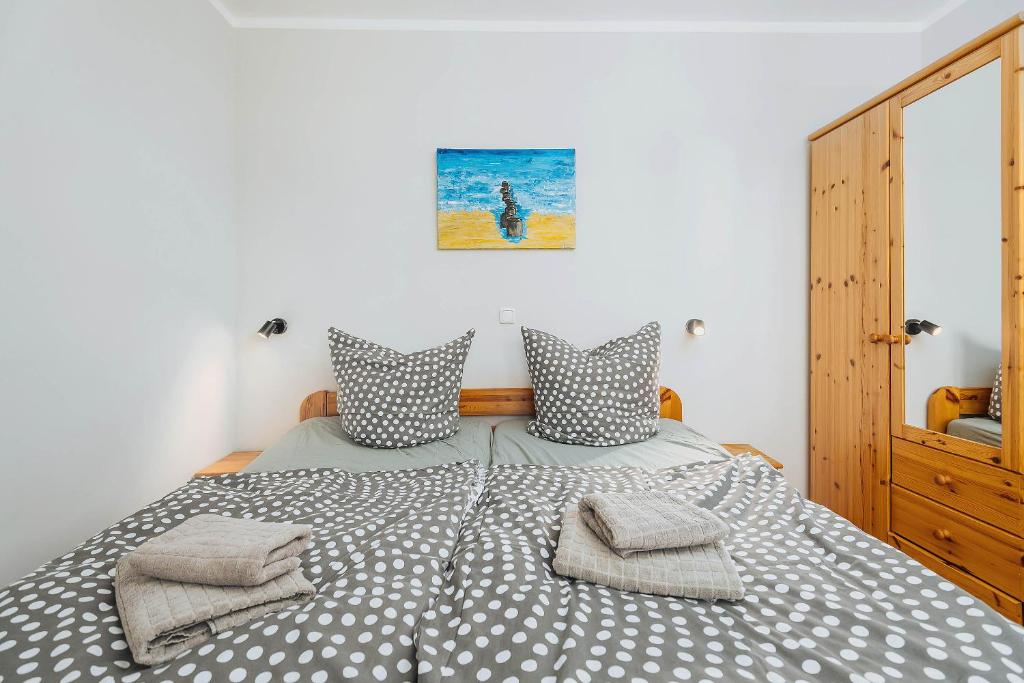 Postel nebo postele na pokoji v ubytování Kuddels Fischerhus 2