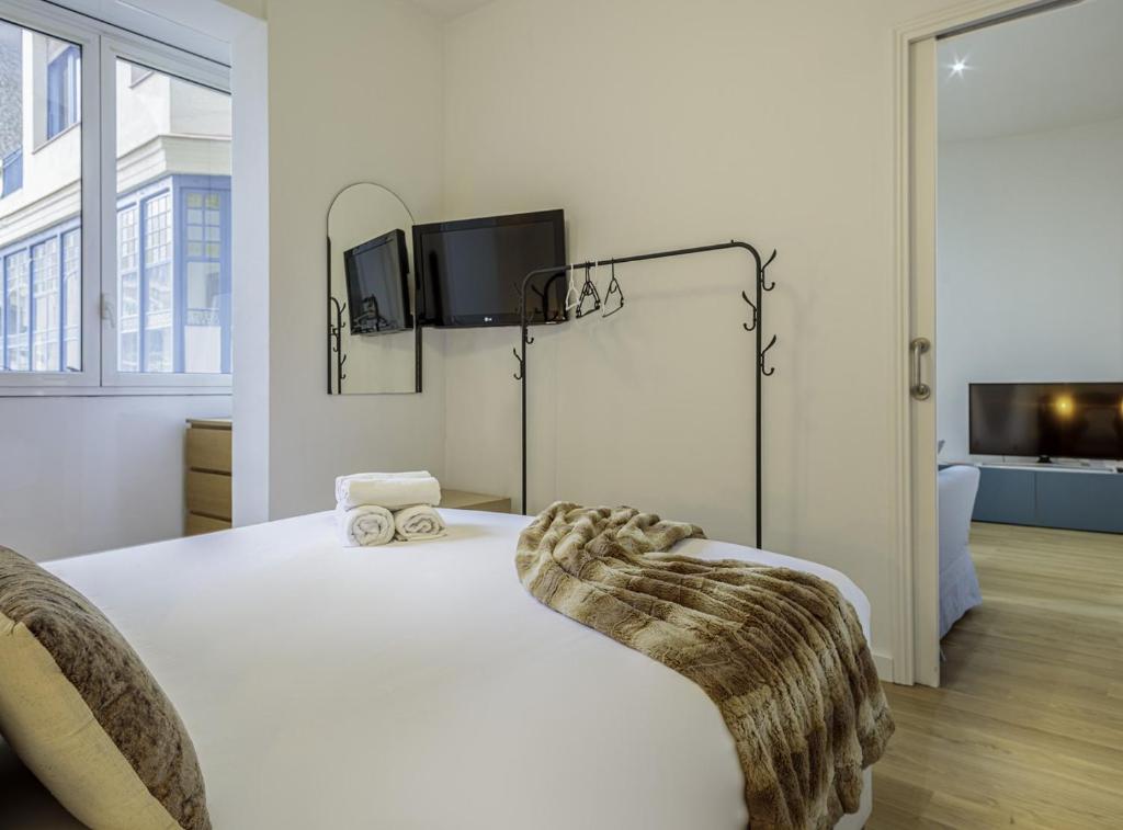 Posteľ alebo postele v izbe v ubytovaní The Gaudi Suites II
