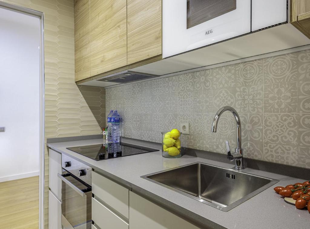 Kuchyňa alebo kuchynka v ubytovaní The Gaudi Suites II