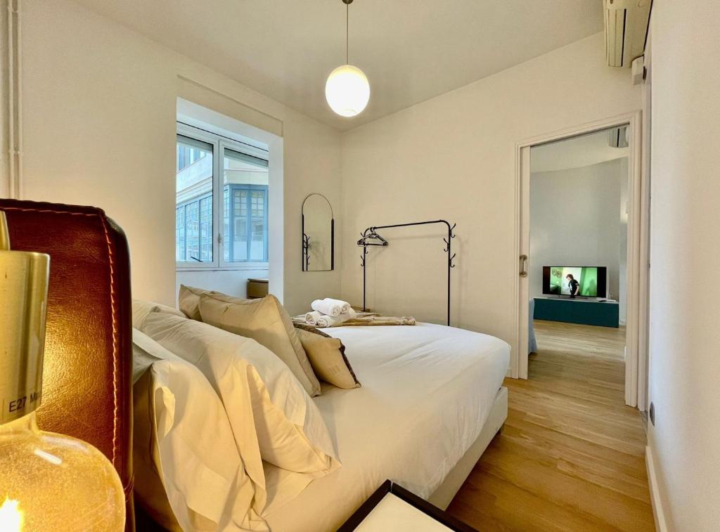 Posteľ alebo postele v izbe v ubytovaní The Gaudi Suites II