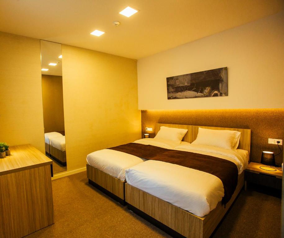 Postel nebo postele na pokoji v ubytování West Hotel Ataman