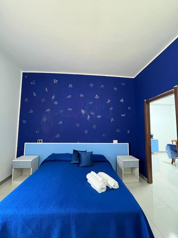 Postel nebo postele na pokoji v ubytování B&B Andromeda