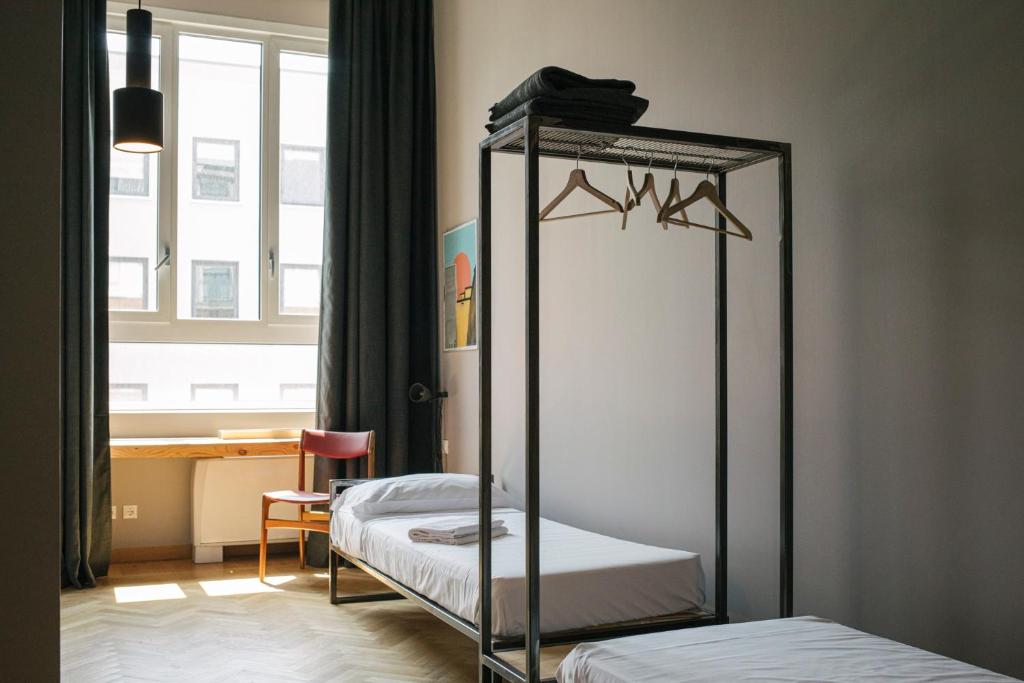 Postel nebo postele na pokoji v ubytování casaBASE