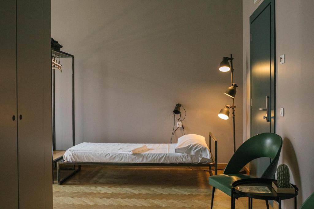 Postel nebo postele na pokoji v ubytování casaBASE
