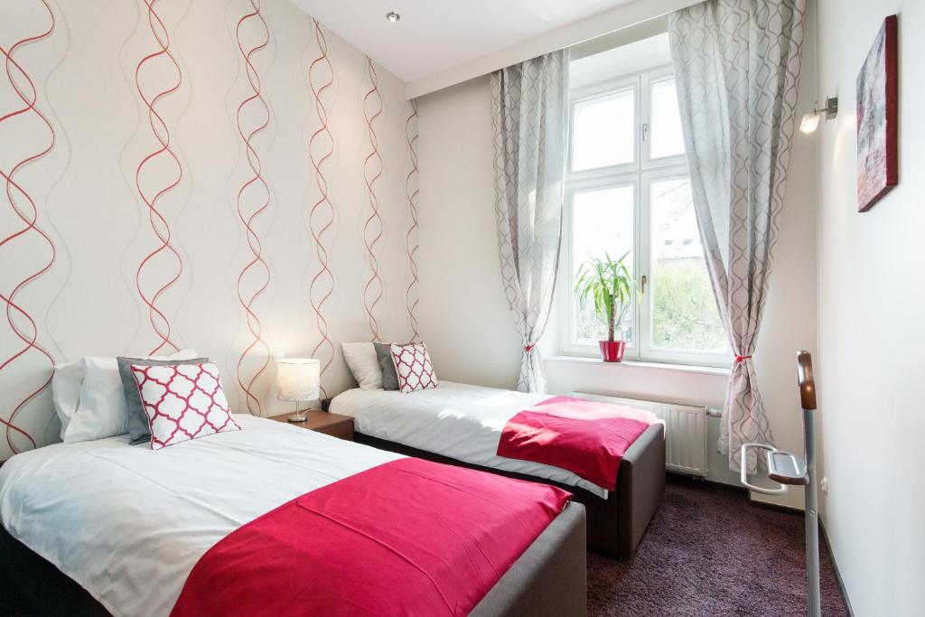 Posteľ alebo postele v izbe v ubytovaní Neo Apartments