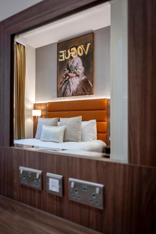 Postel nebo postele na pokoji v ubytování Grand Concerto Hotel