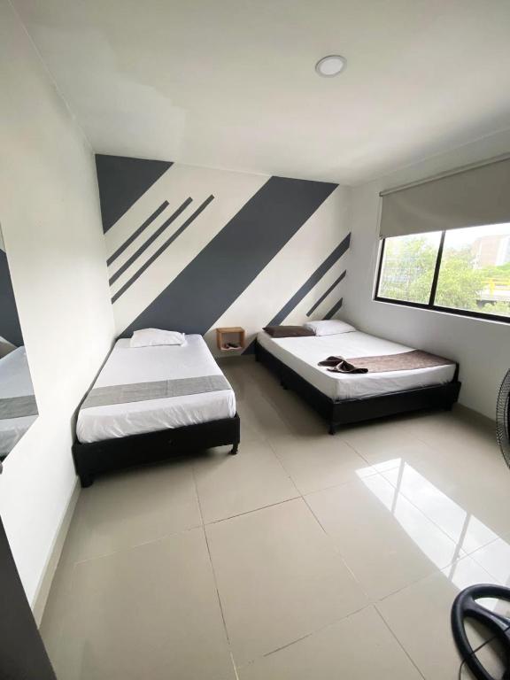 Postel nebo postele na pokoji v ubytování 33 Hotel Bulerias