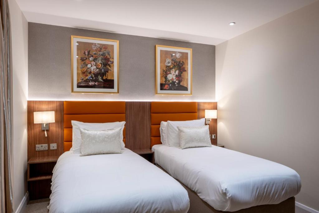 Postel nebo postele na pokoji v ubytování Grand Concerto Hotel