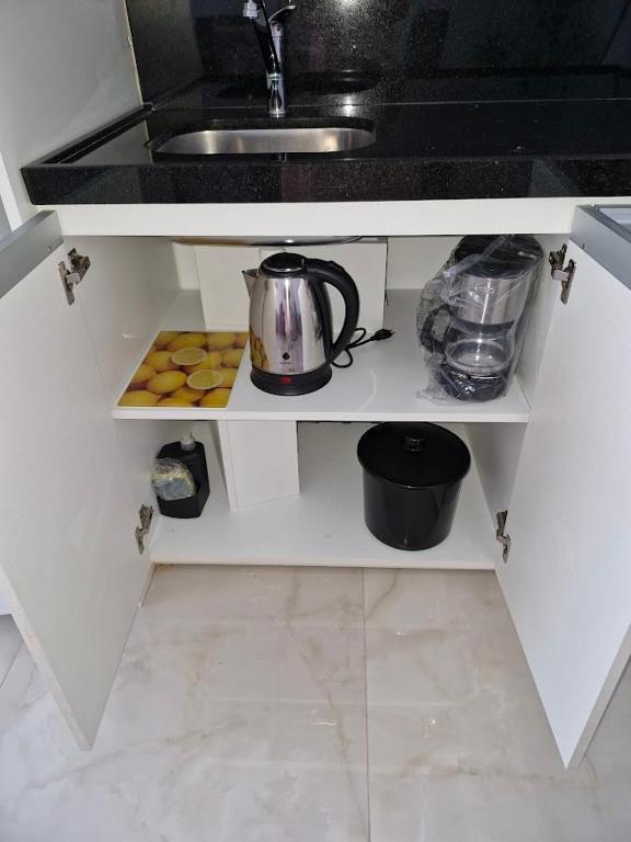 Kuchyň nebo kuchyňský kout v ubytování Loft confortável com garden