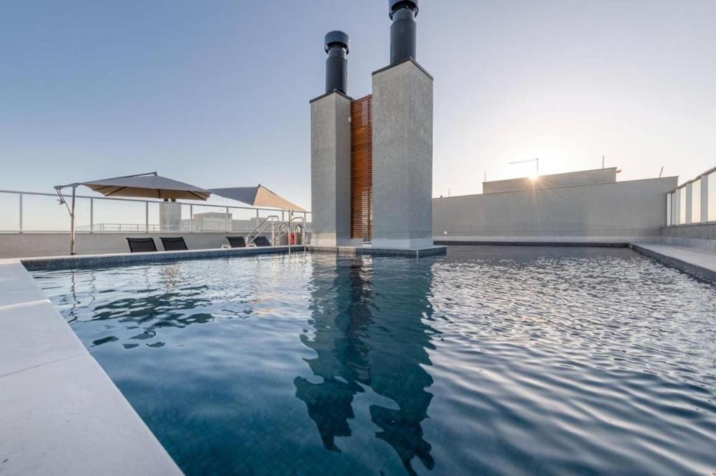 Bazén v ubytování Loft confortável com garden nebo v jeho okolí