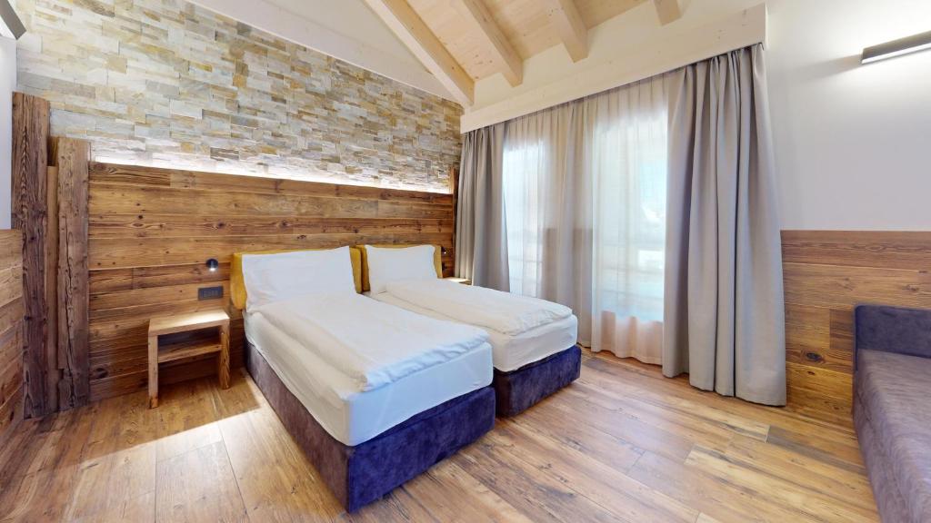 Posteľ alebo postele v izbe v ubytovaní Hotel Gardenia