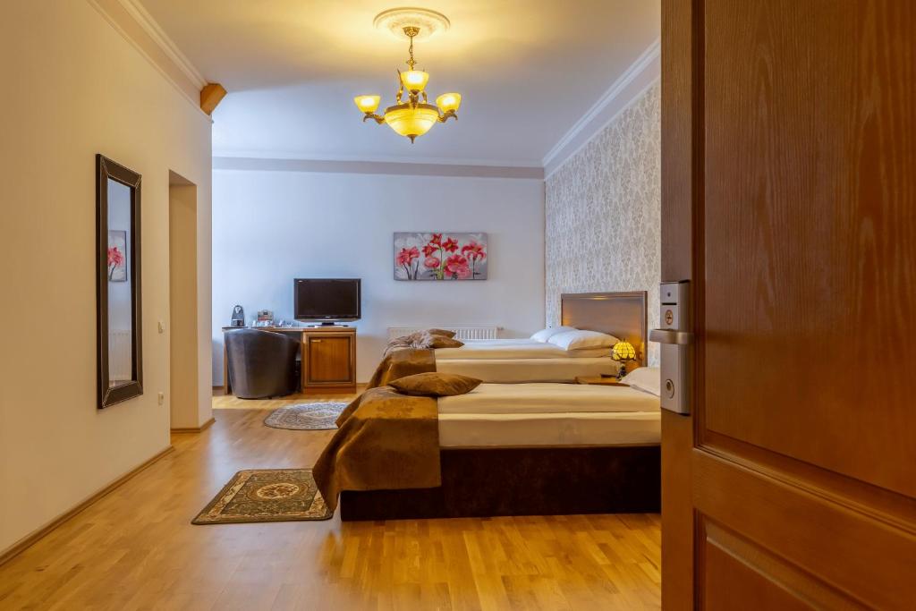 Postel nebo postele na pokoji v ubytování Hotel Boutique Bulevard