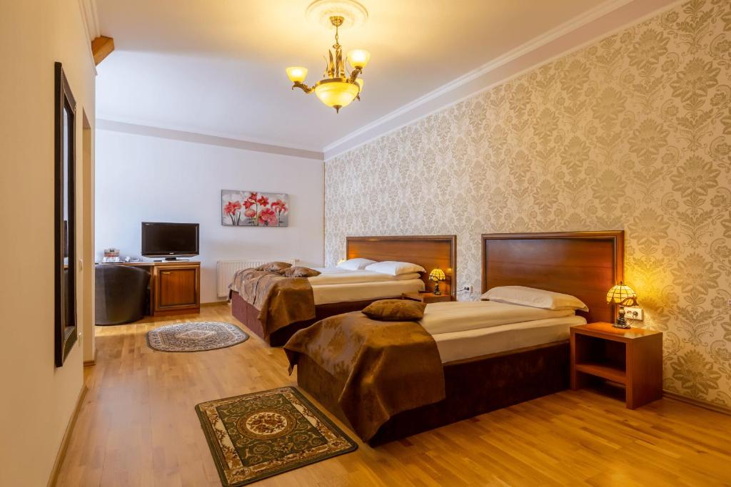 Postel nebo postele na pokoji v ubytování Hotel Boutique Bulevard