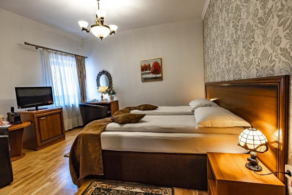 Postel nebo postele na pokoji v ubytování Hotel Boutique Bulevard