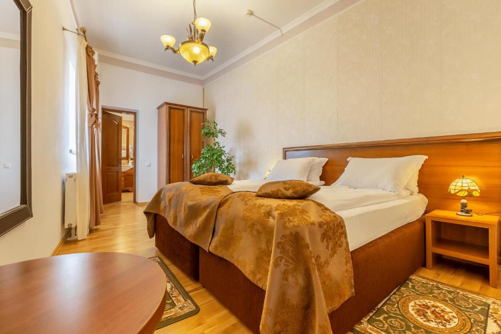 Postel nebo postele na pokoji v ubytování Hotel Boutique Bulevard