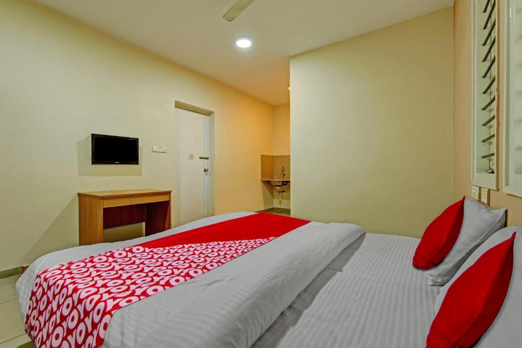 Postel nebo postele na pokoji v ubytování Super Hotel O Indra Suites