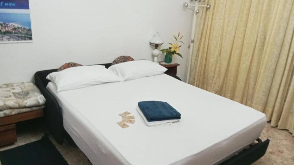 Postel nebo postele na pokoji v ubytování FAMAGOSTA Home