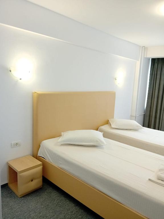 Postel nebo postele na pokoji v ubytování Hotel viilor