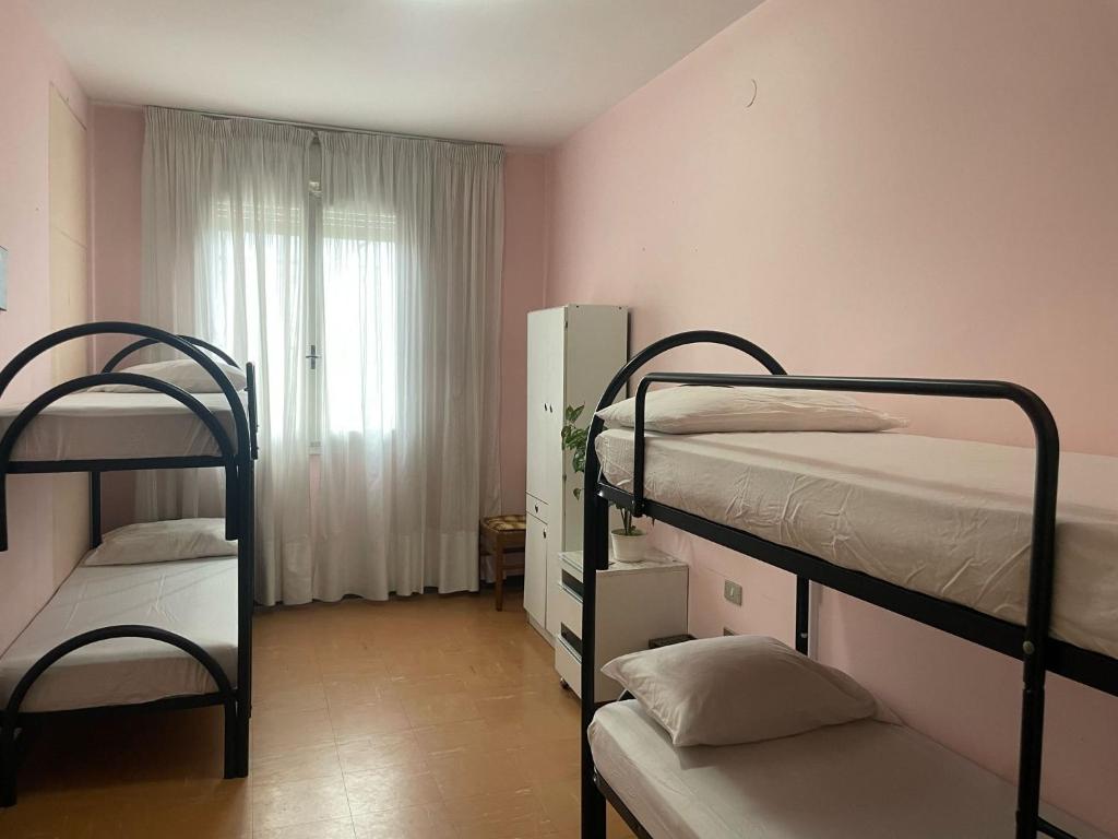 Postel nebo postele na pokoji v ubytování FAMAGOSTA Home
