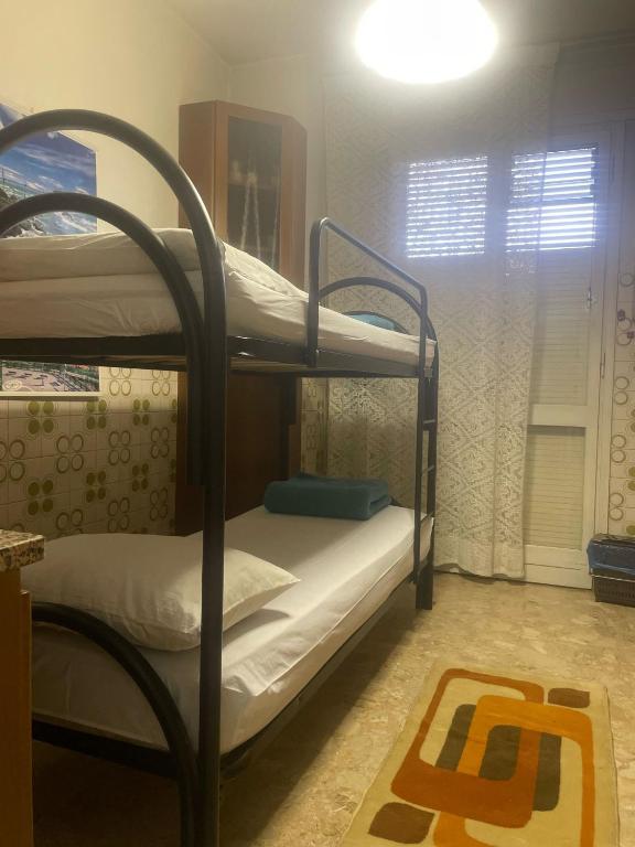 Postel nebo postele na pokoji v ubytování FAMAGOSTA Home