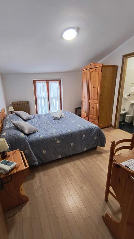 Postel nebo postele na pokoji v ubytování Hotel Blanchetti