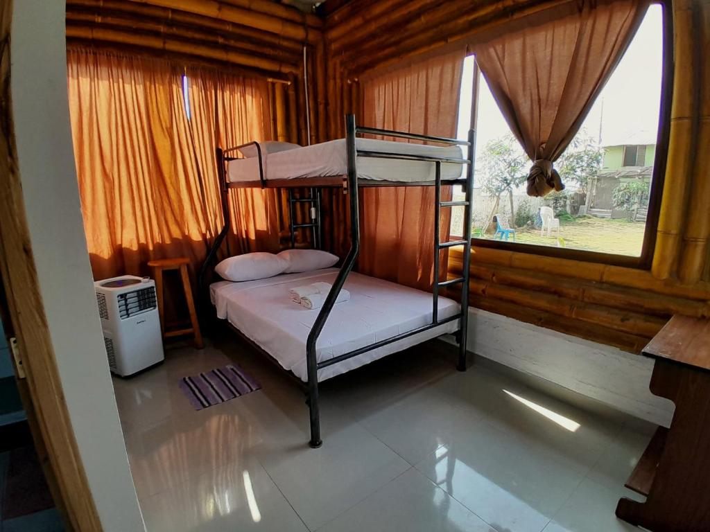 Postel nebo postele na pokoji v ubytování Hostal Fara