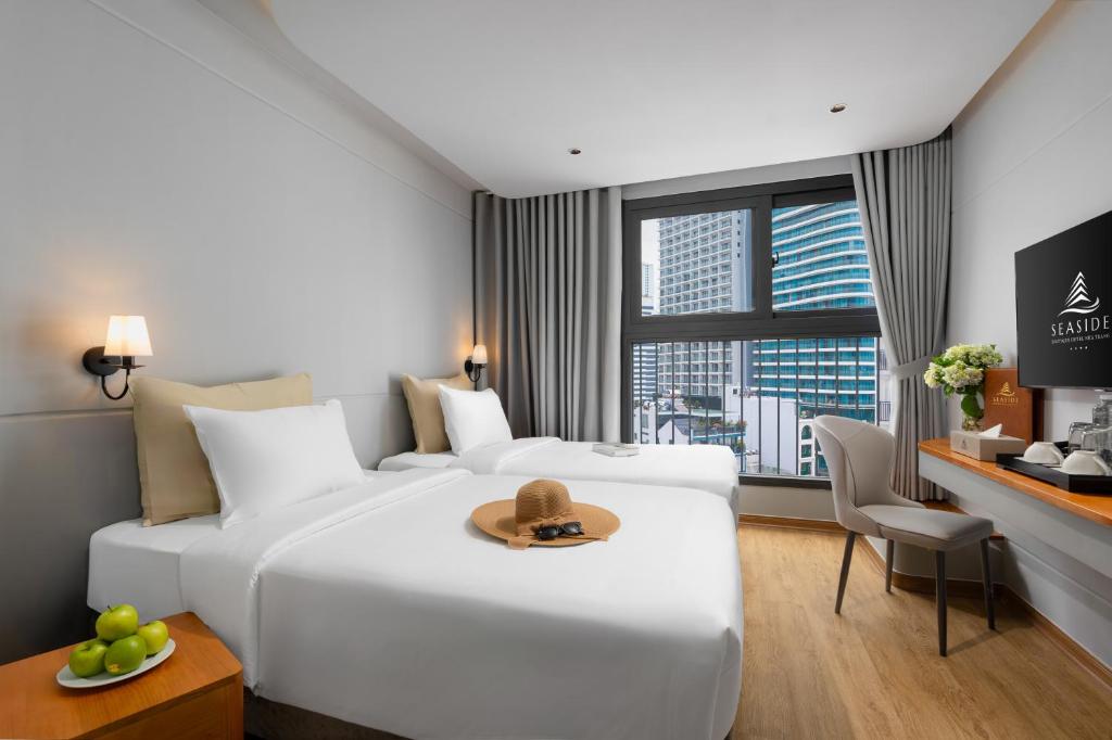 Postel nebo postele na pokoji v ubytování Seaside Boutique Hotel Nha Trang Beach