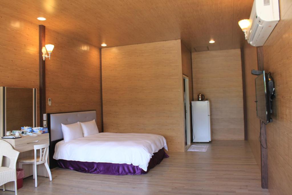 Rúm í herbergi á Kenting Dream House