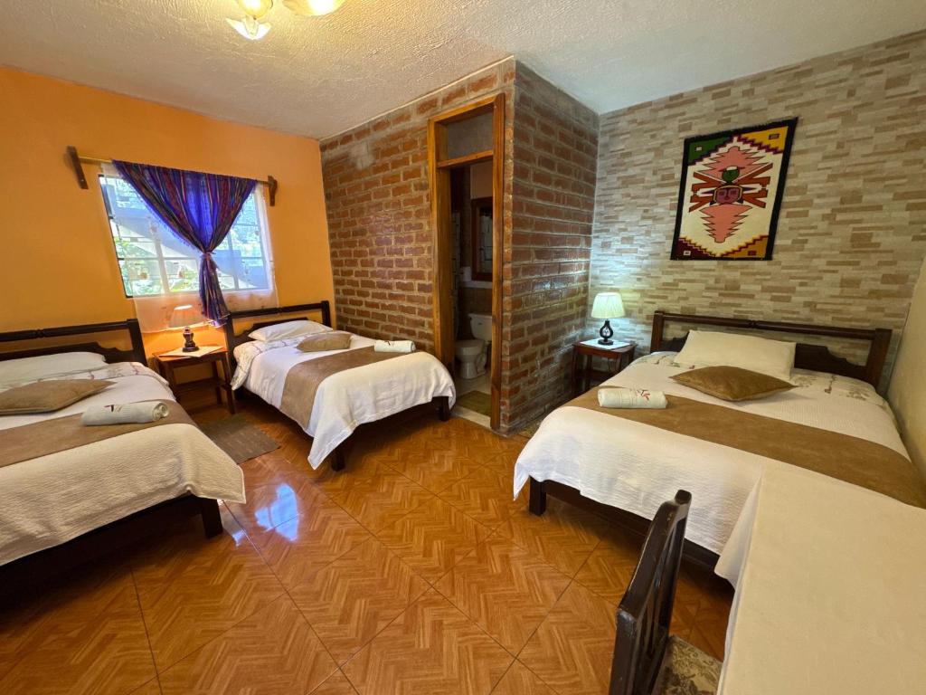 Postel nebo postele na pokoji v ubytování Hotel Donde Ivan