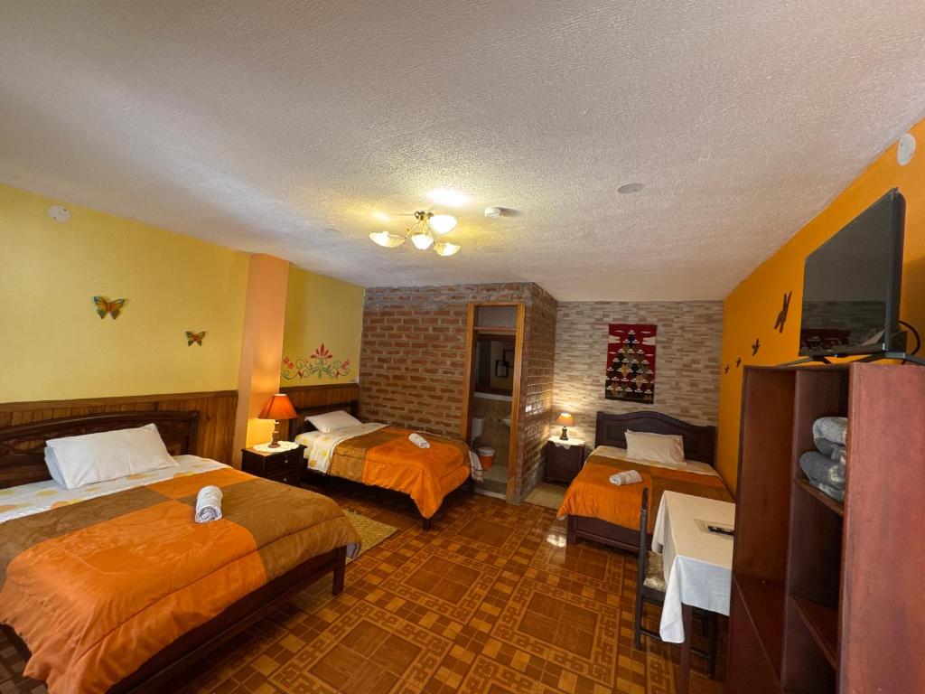 Postel nebo postele na pokoji v ubytování Hotel Donde Ivan