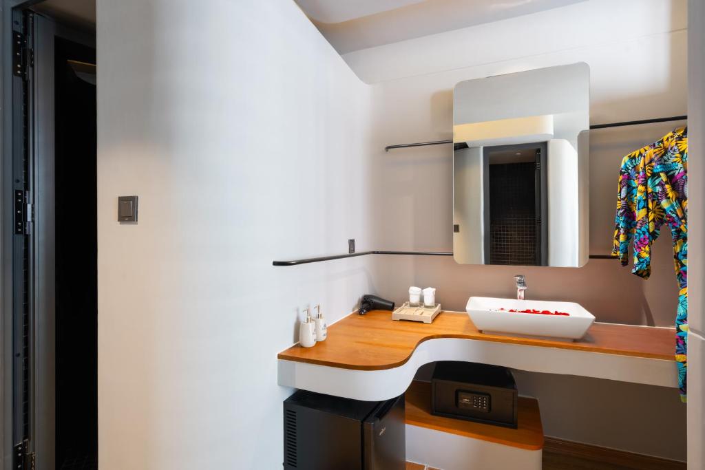 Postel nebo postele na pokoji v ubytování Seaside Boutique Hotel Nha Trang Beach