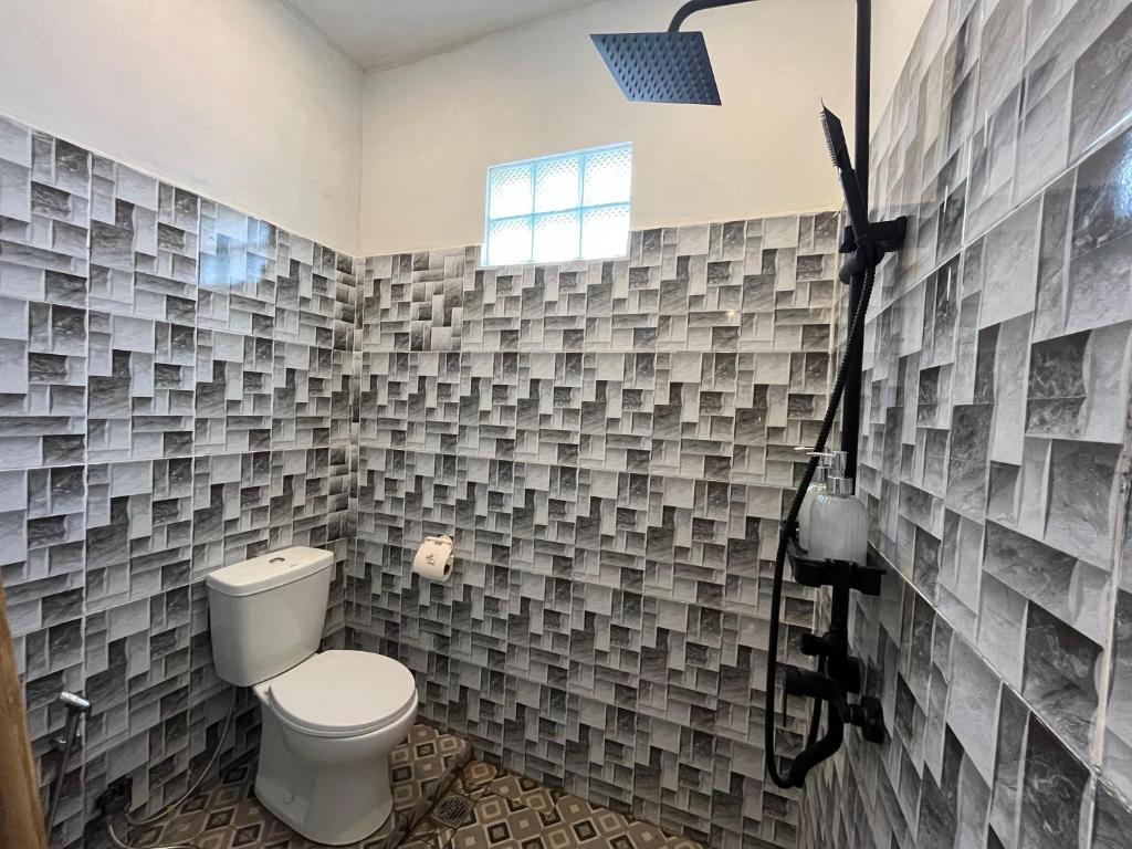 Koupelna v ubytování Tyana House Kuta Lombok