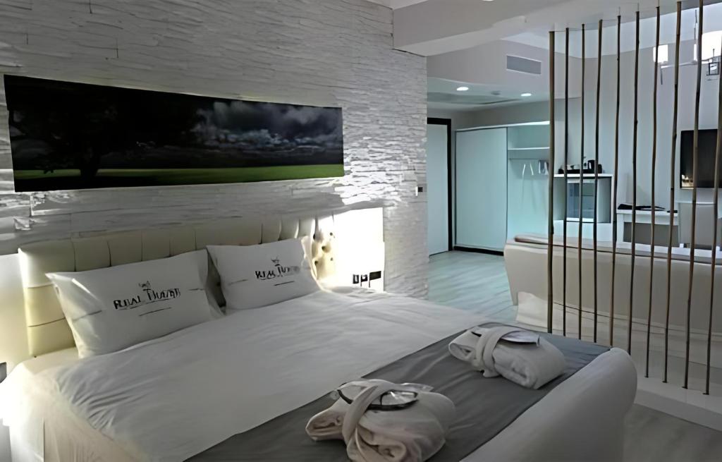 Postel nebo postele na pokoji v ubytování Real House Hotel