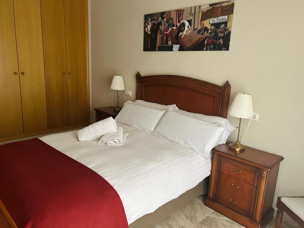 A bed or beds in a room at Los Marqueses de Teruel- VUT El Marqués