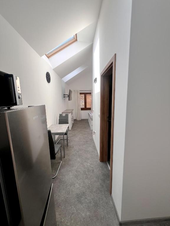 TV a/nebo společenská místnost v ubytování Apartmány Pod Řípem