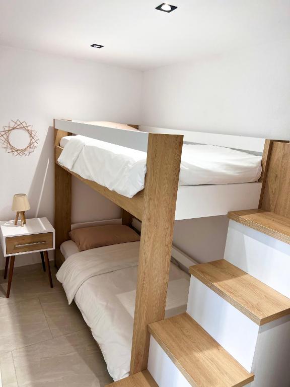Postel nebo postele na pokoji v ubytování Aloha House