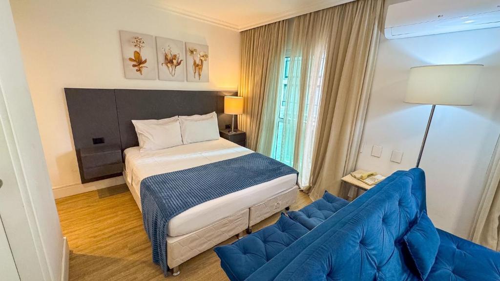 En eller flere senge i et værelse på Hotel em Perdizes - FLAT504 - By TorresGuest