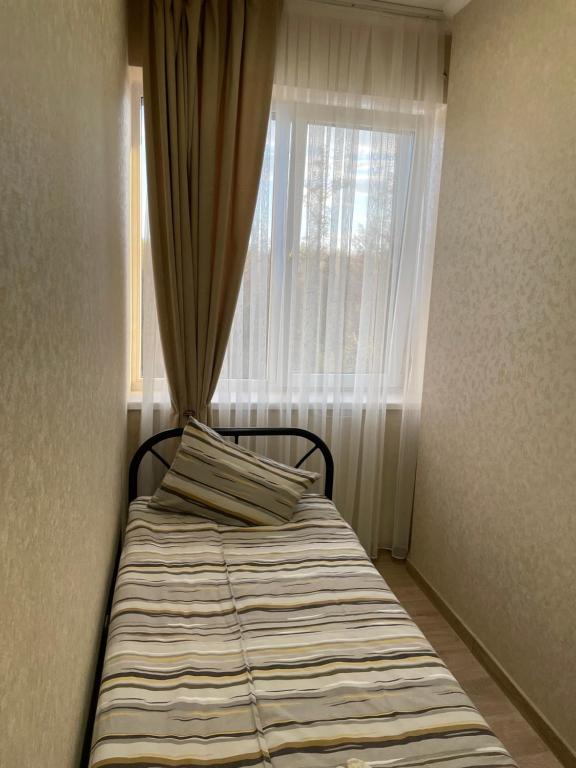 Postel nebo postele na pokoji v ubytování Mini Hotel Leon